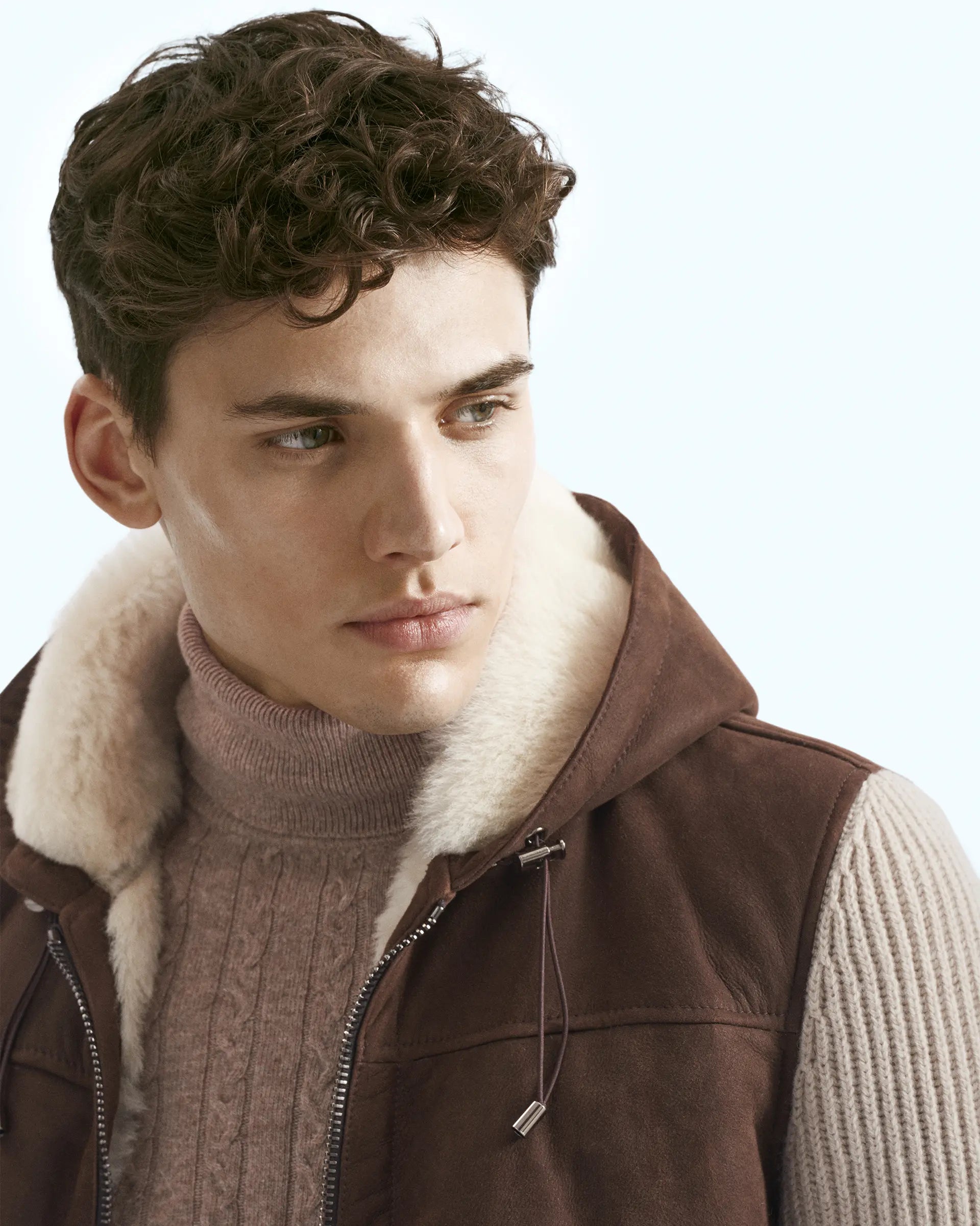 Shearling jacket with knitted sleeves