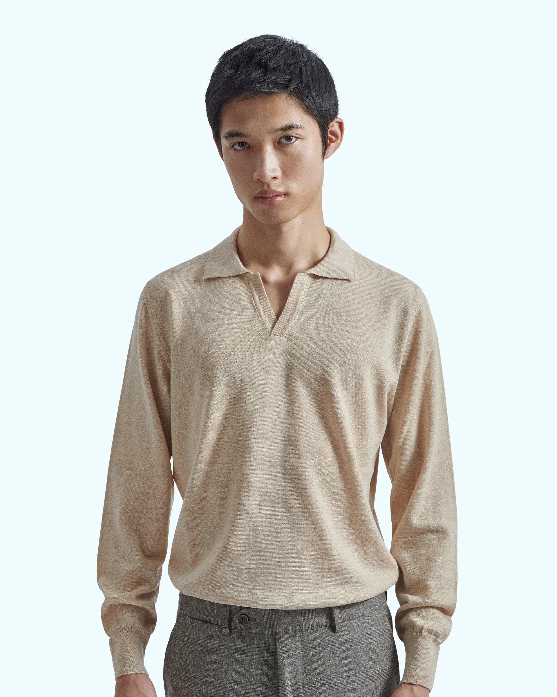 Beige buttonless polo in pure extrafine merino wool