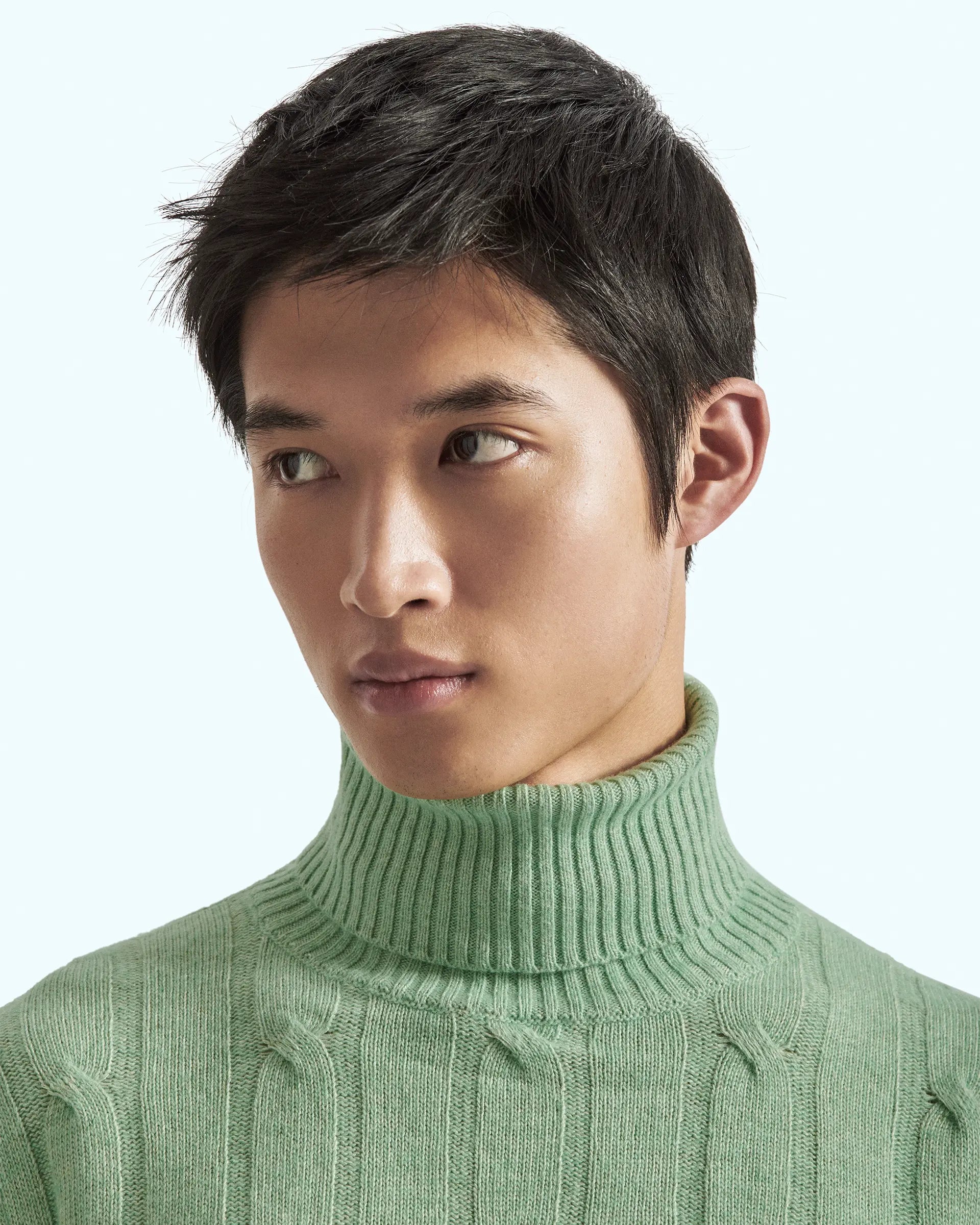 Green turtleneck in cashmere blend with cable knit