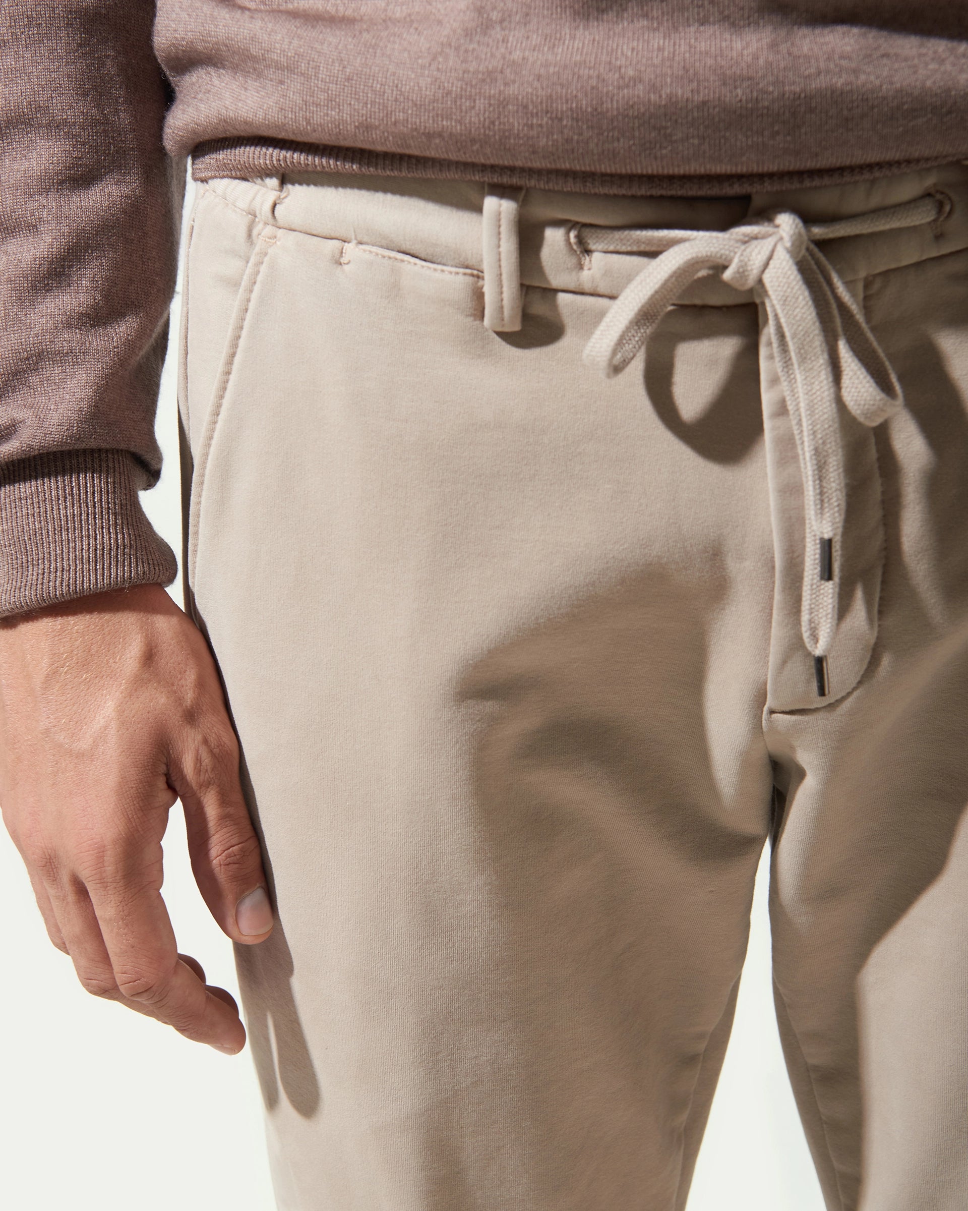 Beige garment-dyed jersey trousers with drawstring and elastic
