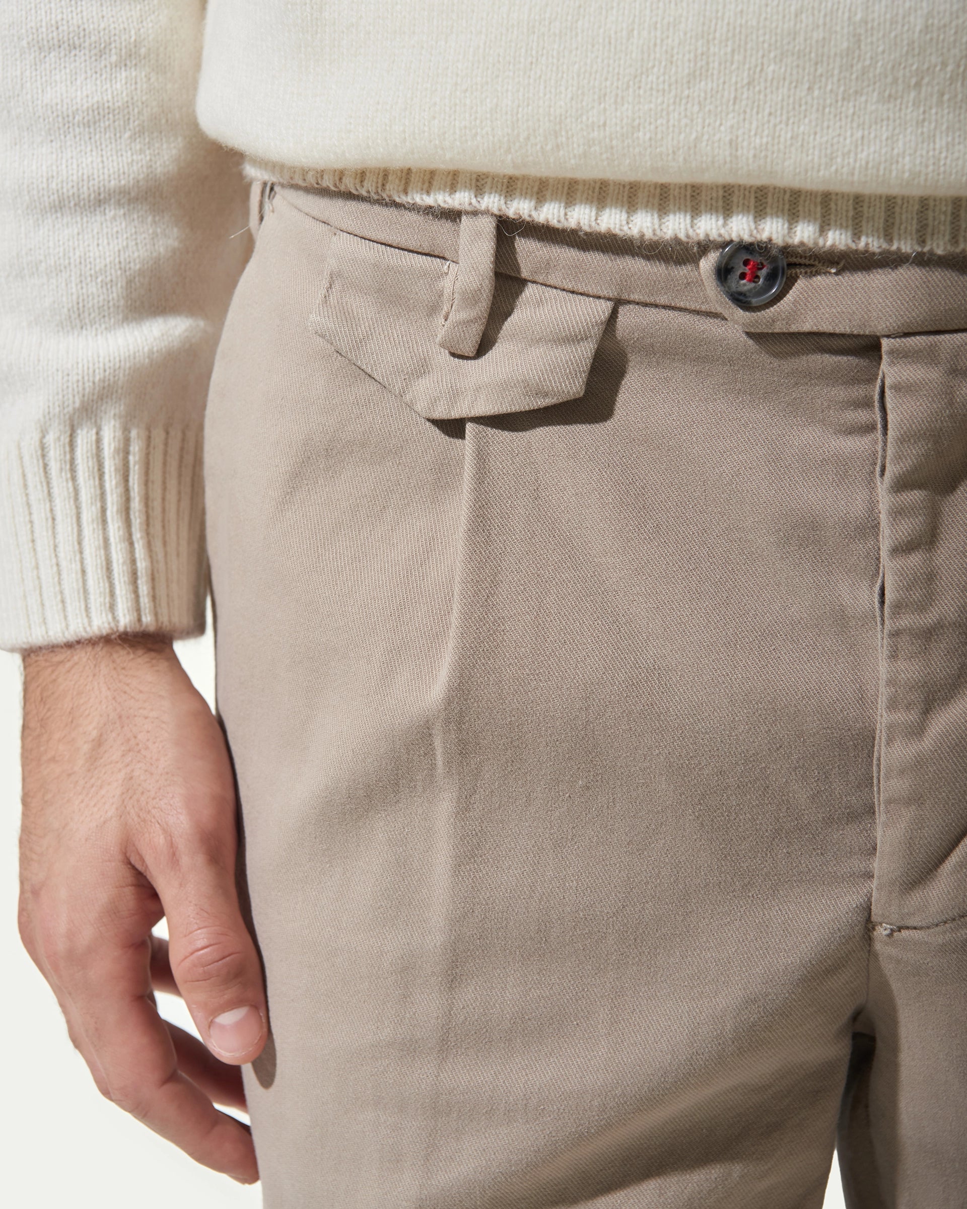 Brown Carrot trousers in stretch cotton with pleats and button placket