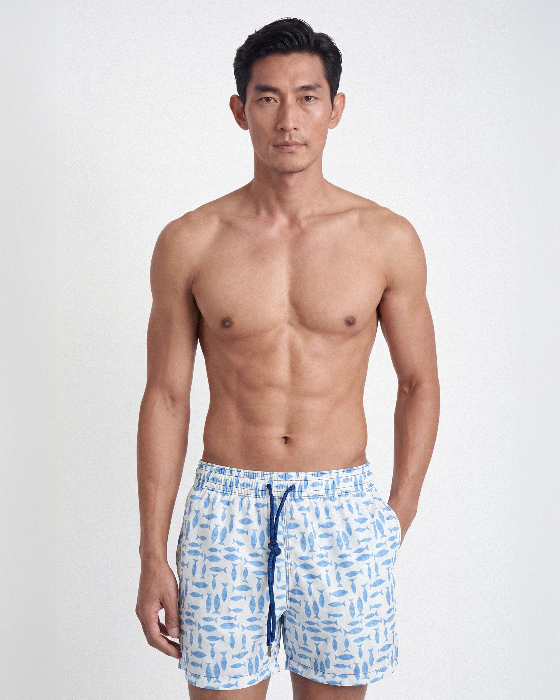 Patterned swim shorts with a marine theme