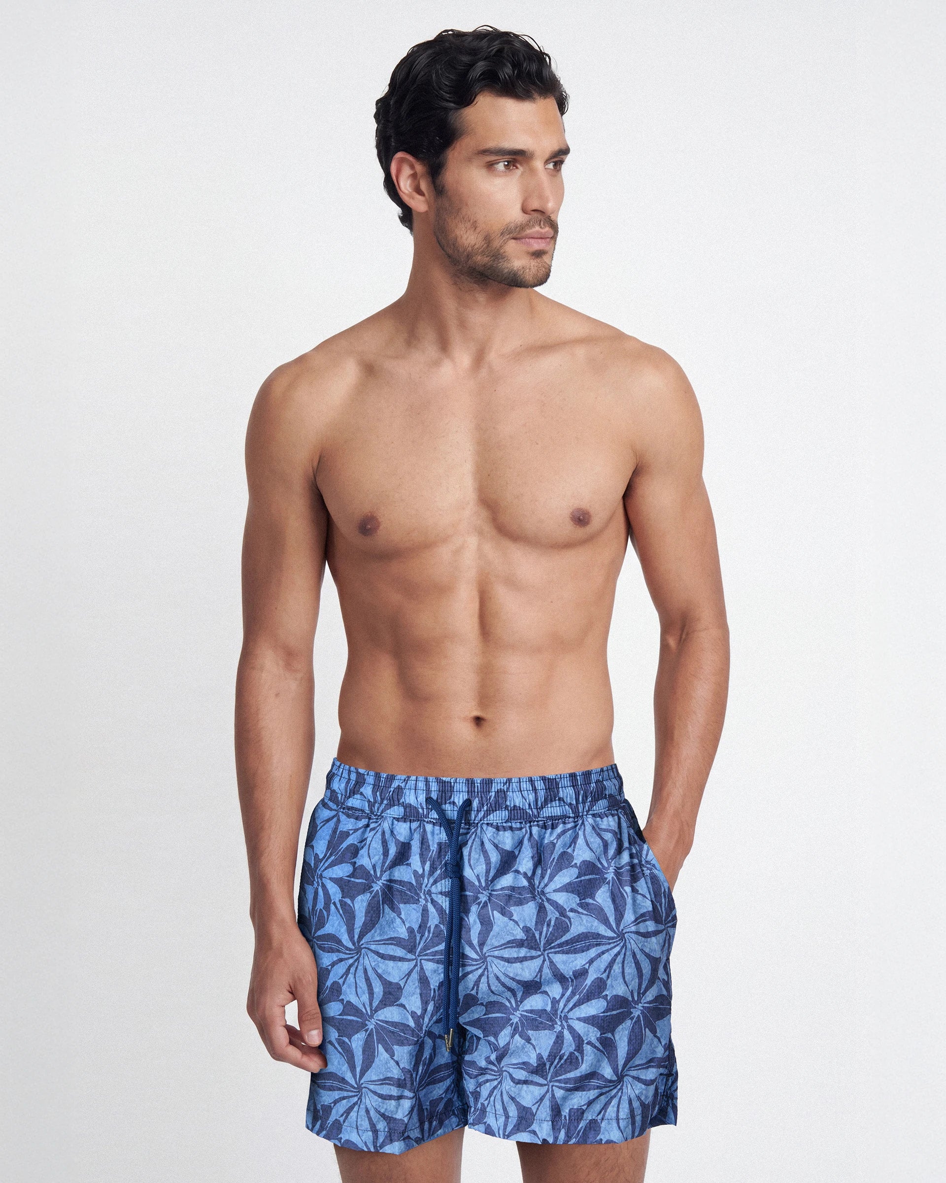 Patterned swim shorts with botanical motifs