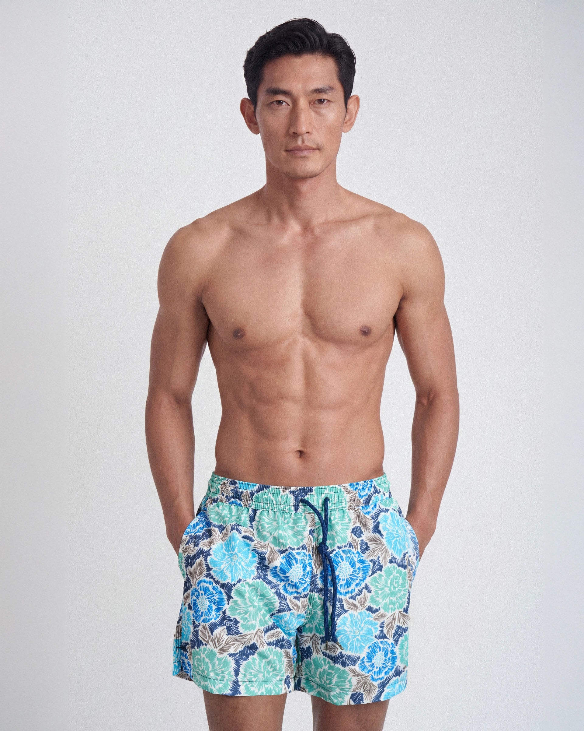 Patterned swim shorts with botanical motif
