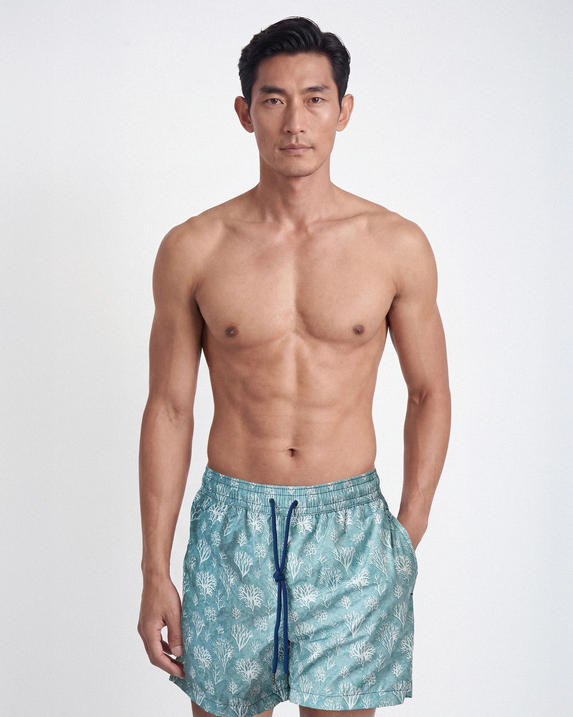 Patterned swimming trunks with a botanical motif