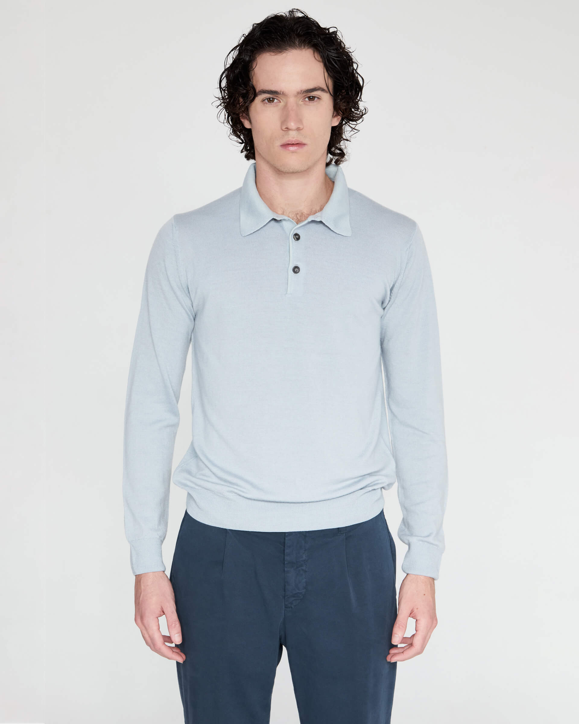 Polo con bottoni  celeste in lana merinos extrafine fade finezza 12